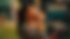 A woman is drinking a pepsi bottle