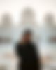 Photo shot of a woman in front of the Sheikh Zayed Moschee