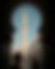 A tower of the Sheikh Zayed Moschee with people walking in front